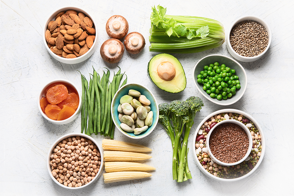 Food sources of plant based protein. Healthy diet with  legumes, dried fruit, seeds, nuts and vegetables.  Foods high in protein, antioxidants, vitamins and fiber.